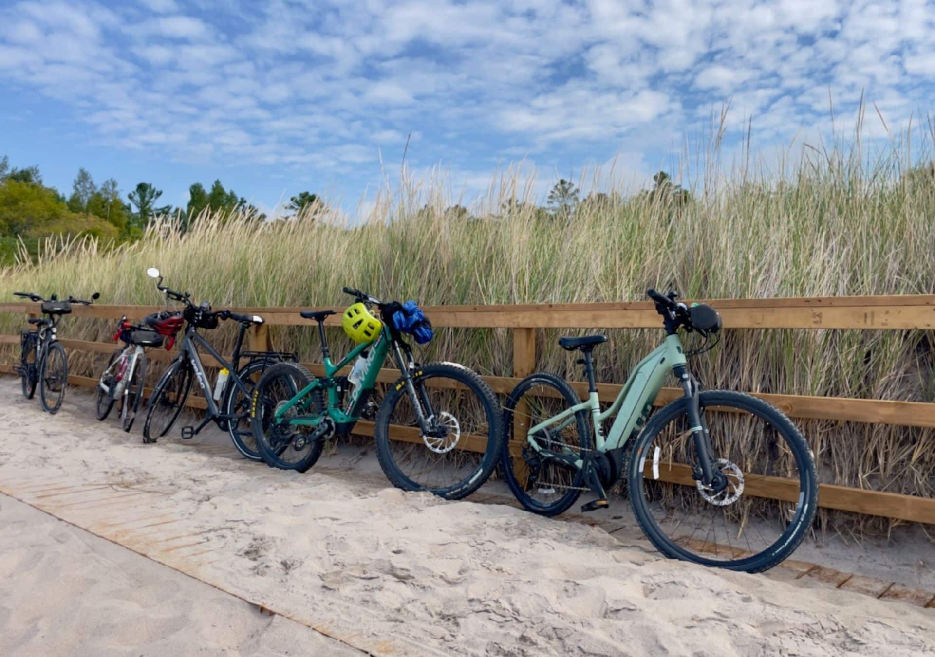 Bicycles parked near sandy beach