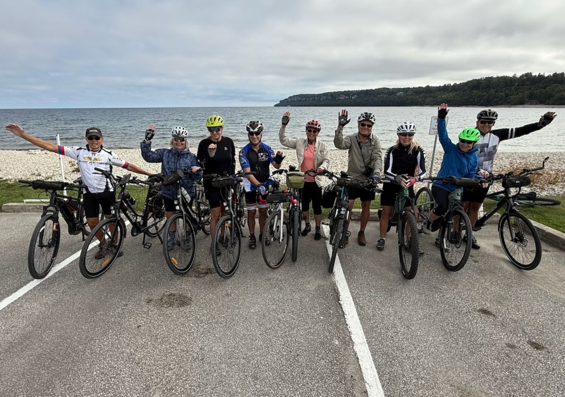 Group of cyclists by the beach.