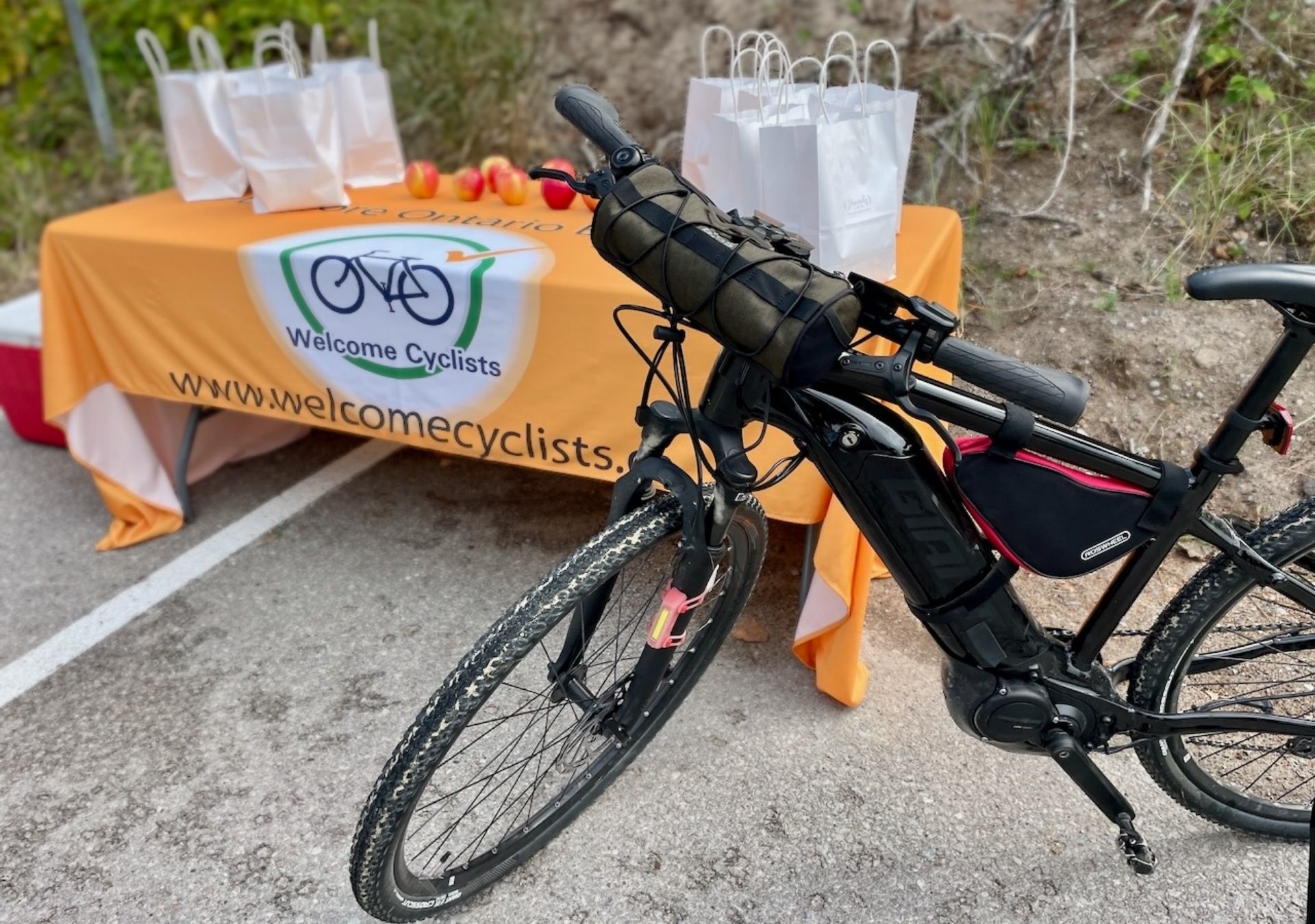 Bicycle next to welcome table.
