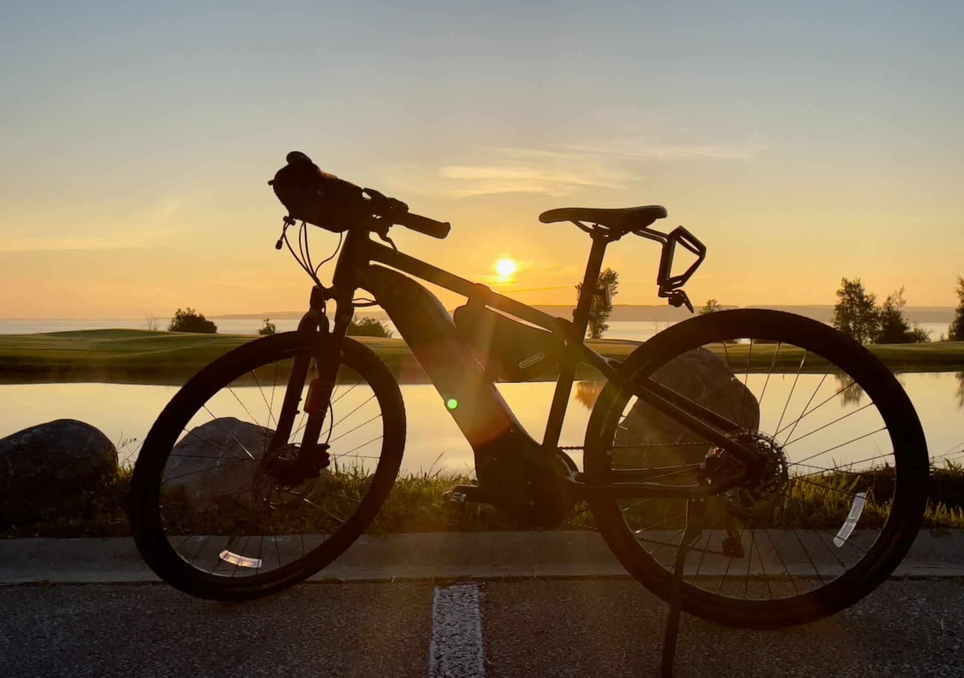 Bicycle silhouette against sunset backdrop