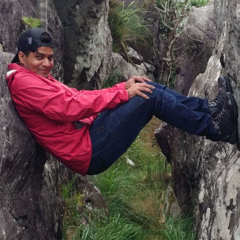 Person resting between two rocks.